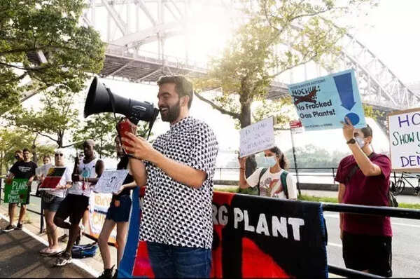 Mamdani in smart casual attire at a rally